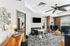 Clubhouse with stylish decor, comfortable seating, and large windows for natural light, perfect for relaxation.