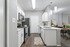 Contemporary kitchen with sleek stainless steel appliances and elegant dining area, perfect for entertaining.