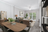 Elegant living area with plush seating, modern decor, and natural light streaming through sliding glass doors, perfect for relaxation.
