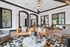 Elegant clubhouse with stylish furniture, high ceilings, and a grand chandelier, perfect for modern luxury living.