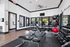 Modern fitness center with treadmills, weight benches, and vibrant exercise balls in a bright, inviting space.