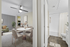 Sophisticated apartment interior showcasing a cozy dining area, stylish living room, and modern bathroom with elegant decor.