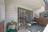 Charming balcony space with stylish furniture, accent plants, and a cozy ambiance for relaxation.