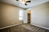 2nd view of carpeted bedroom, closet view