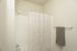 bathroom with tub and shower