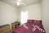 bedroom with desk bed and dressers