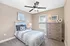 Inviting bedroom with elegant decor, featuring a plush bed, stylish bedside lamps, and warm tones for a cozy ambiance.