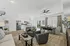 Bright and spacious open-concept living room with elegant decor, featuring a modern kitchen and dining area, perfect for entertaining.