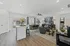 Bright, modern living area featuring an open-concept design with stylish decor, cozy seating, and abundant natural light.