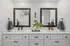 Elegant bathroom with double vanity, sleek mirrors, and modern fixtures, offering a touch of luxury and style.