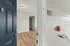 Inviting entrance to a modern apartment featuring elegant wood flooring and neutral-colored walls, marked as unit B-20.