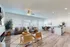 Modern open-concept living space with plush seating, stylish dining area, and elegant kitchen, bathed in natural light.