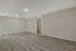 Spacious living area featuring elegant wood flooring and a bright, minimalist design, perfect for customization.