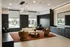 Contemporary lounge area featuring plush seating, elegant lighting, and scenic window views with lush greenery.