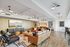 Contemporary living space featuring elegant leather seating, modern lighting, and a stylish open-concept design with chic decor.