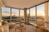 Bright and contemporary living room at The Zenith in Baltimore featuring spacious seating, large windows, and stylish finishes.