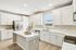 Kitchen with white cabinets and stainless steel appliances