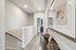 hallway with console table and view of the stairs
