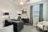 furnished office with desk and window