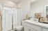 Bathroom with standing glass shower