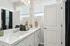 Bathroom with two sinks and large mirror