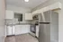 Modern kitchen with sleek stainless steel appliances, granite countertops, and crisp white cabinetry.