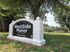 Charming WestSide Manor entrance sign surrounded by lush greenery, offering tranquil apartment living at 931 Frayser Blvd.
