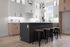 Modern kitchen featuring sleek cabinetry, a spacious island with bar stools, and elegant pendant lighting.