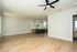 Elegant open-concept apartment with stylish hardwood floors and a modern kitchen with sleek cabinetry and island.