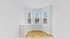 Bright room with hardwood floors, stylish bay windows, and a scenic city view.