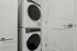 Sleek and efficient laundry area featuring a modern stacked washer and dryer in a compact space.