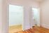 Bright and spacious apartment corner featuring sleek hardwood floors, ample storage with a walk-in closet, and in-unit laundry for modern convenience.