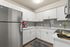 Glass Backsplash and Gooseneck Faucet with Spray Nozzle