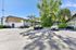 Charming apartment complex with lush greenery and convenient parking.