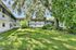 Lush courtyard surrounded by two-story apartment buildings with charming balconies.