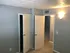 Inviting room with soft lighting, freshly painted walls, and cozy carpet flooring showcasing practical closet and hallway access.