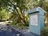 Charming communal mailbox setup nestled in a lush, green landscape, offering convenience in a serene environment.