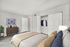 Bright and cozy bedroom with modern decor, featuring a comfortable bed, elegant dresser, and spacious closet.
