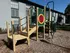 Inviting outdoor playground with a colorful climbing structure, perfect for family fun in a well-maintained residential community.