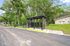 Charming outdoor mailbox pavilion amidst lush greenery, offering convenience and natural beauty.