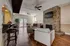 Charming living room featuring a modern fireplace, sleek hardwood floors, and a cozy seating area with stylish furniture.
