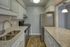 Contemporary kitchen with elegant granite countertops, stainless steel appliances, and sleek cabinetry.