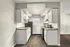 Charming kitchen with sleek black appliances, elegant white cabinets, and inviting wood flooring.