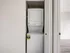 Compact and efficient in-unit laundry with stacked washer and dryer, enhancing convenience and modern living.
