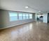 Spacious apartment with large windows offering stunning waterfront views and abundant natural light.