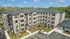 Charming apartment complex with modern brick and stucco facade, surrounded by lush greenery and ample parking, offering a tranquil and inviting living environment.