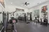 Modern fitness center with state-of-the-art equipment, including weight machines, cardio machines, and a bright, inviting atmosphere.
