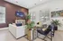 Chic and modern living room with stylish furniture, indoor plants, and contemporary decor in a sunlit space.