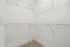 Spacious walk-in closet with multiple wire shelves, perfect for organized storage.