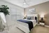 Bright and inviting bedroom with elegant decor, featuring a plush bed, modern art, and abundant natural light.